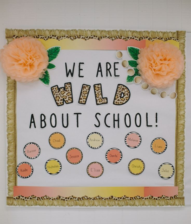 we are wild about school bulletin board with orange flowers and polka dots on it,