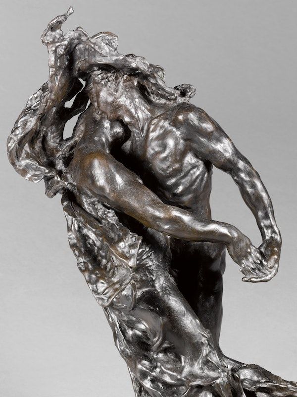 a bronze statue of a man holding a woman's head with both hands on his back