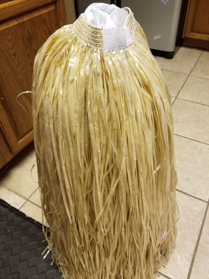 a large piece of grass sitting on top of a kitchen floor