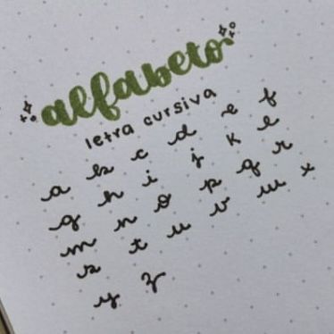 an open notebook with writing on it and the word alfabro written in cursive