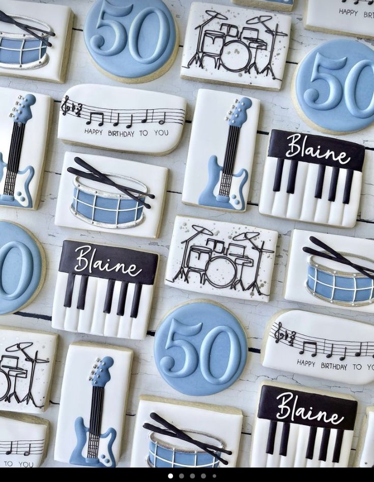 decorated cookies with musical instruments and the number 50 on them for someone's 50th birthday