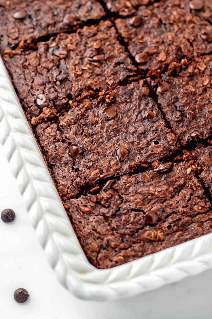 a close up of a cake in a pan with chocolate chips on the top and bottom