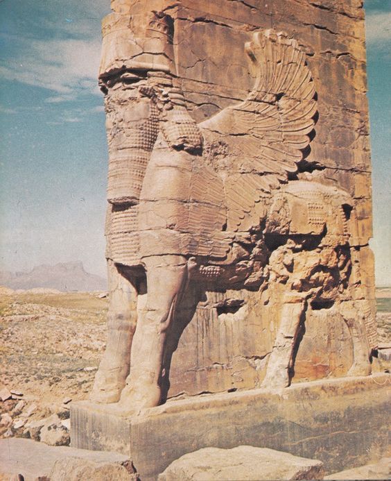 an ancient egyptian statue in the desert