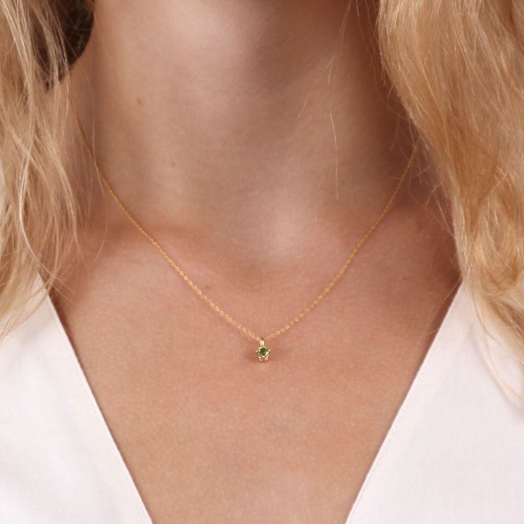 A 4mm peridot rests beneath a sleek high polish bail, offering you a pop of color to go with any outfit. 14k Gold Green Jewelry With Single Diamond, Yellow Gold Polished Peridot Jewelry, Yellow Gold Peridot Jewelry With Polished Finish, Elegant Gold Peridot Birthstone Necklace, Green Minimalist Birthstone Necklace, Gold Peridot Jewelry With Polished Finish, Dainty Peridot Jewelry In Yellow Gold, Dainty Peridot Yellow Gold Jewelry, Classic Yellow Gold May Birthstone Necklace