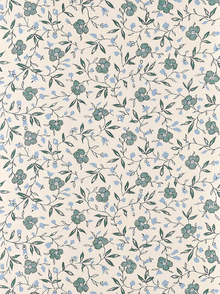 a white and blue floral wallpaper with green leaves on the bottom half of it