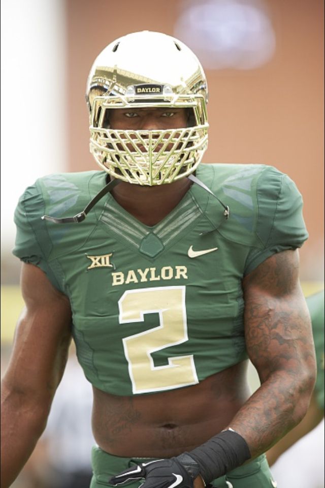 a close up of a football player wearing a uniform