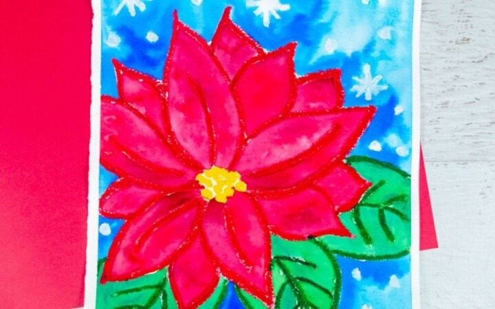 a red poinsettia on a blue background with snowflakes