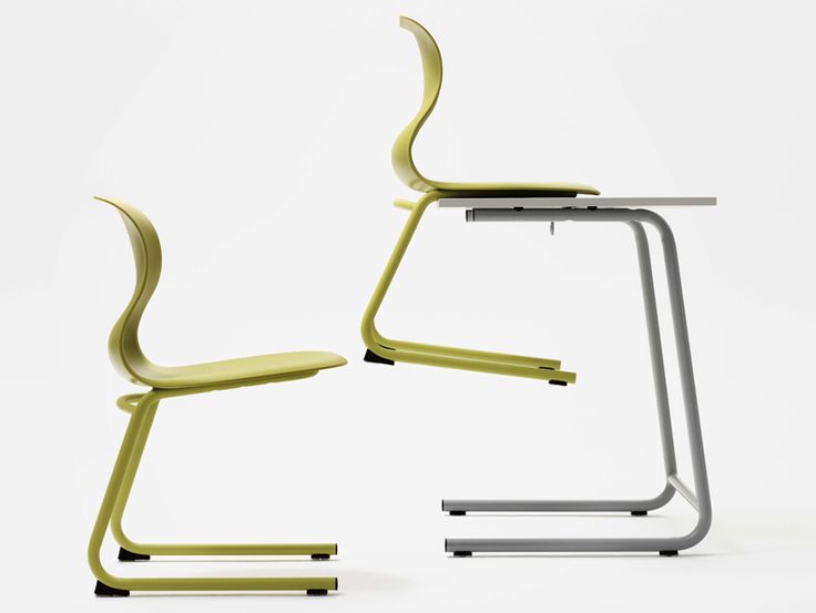 two modern chairs sitting next to each other