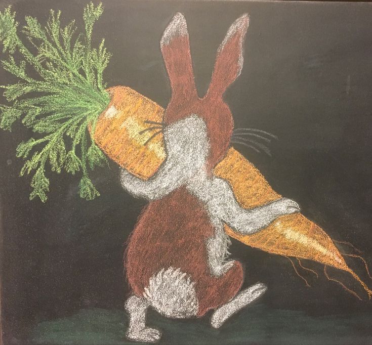 a chalk drawing of a rabbit carrying carrots