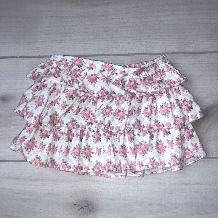 Janie & Jack Pink Floral Corduroy Ruffled Skirt. Pull on elastic waist. Size 3-6 months. Soft cotton corduroy. Excellent Used Condition Cute Cotton Mini Skirt With Ruffles, Cute Cotton Ruffle Skirt, Cute Cotton Ruffled Skirt, Cute Cotton Skirt With Ruffles, Cute Cotton Ruffled Skort, Cute Cotton Skort With Ruffles, Cute Cotton Tiered Skort, Spring Cotton Skirt For Playtime, Spring Ruffled Bottoms For Playtime