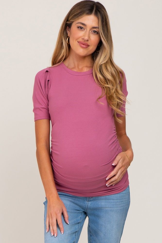 A ribbed fitted maternity top featuring side ruching, short fitted sleeves and a rounded neckline. The Mauve Ribbed Ruched Fitted Maternity Top is perfectly bump-friendly! Spring Short Sleeve Bump-friendly Tops, Bump-friendly Short Sleeve Tops For Spring, Spring Short Sleeve Tops, Bump Friendly, Spring Bump Friendly Short Sleeve Tops, Fitted Nursing Friendly Top With Short Sleeves, Nursing-friendly Fitted Top With Short Sleeves, Fitted Short Sleeve Nursing-friendly Top, Fitted Short Sleeve Nursing Friendly Tops, Nursing Friendly Fitted Short Sleeve Tops