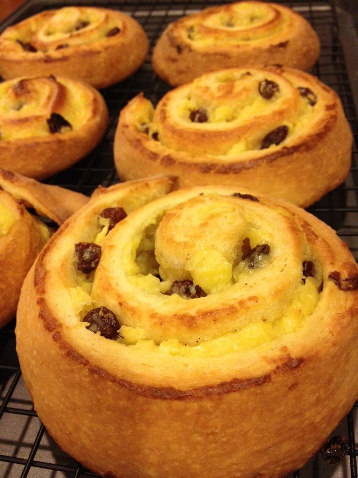 several baked goods are cooling on a rack