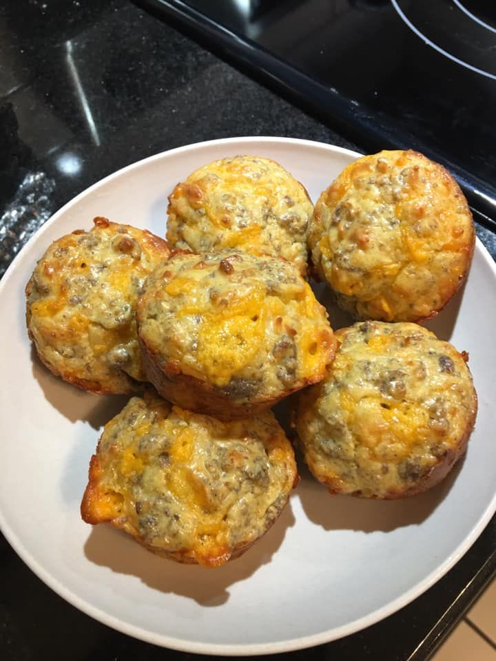 a white plate topped with muffins on top of a stove