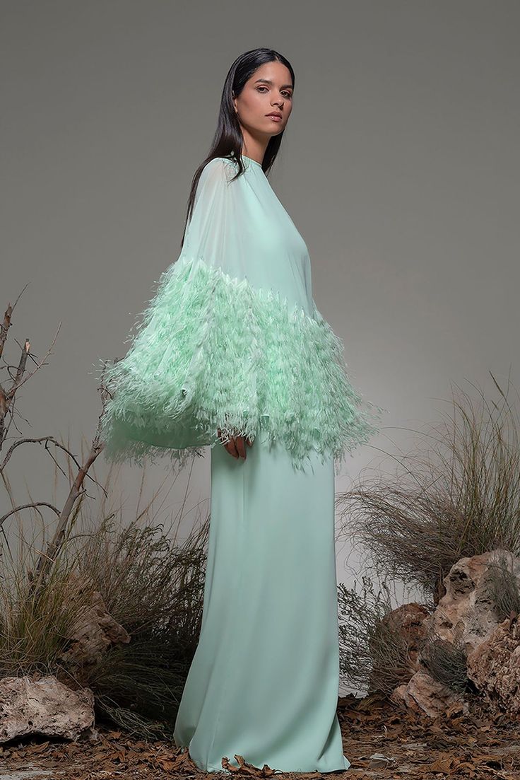 Cape shape bodice A line dress - HerTrove Green Cape Dress, Isabel Sanchis, Gown With Cape, Green Cape, Dress With Feathers, Feather Gown, Dress Cape, Fitted Gowns, Cape Gown