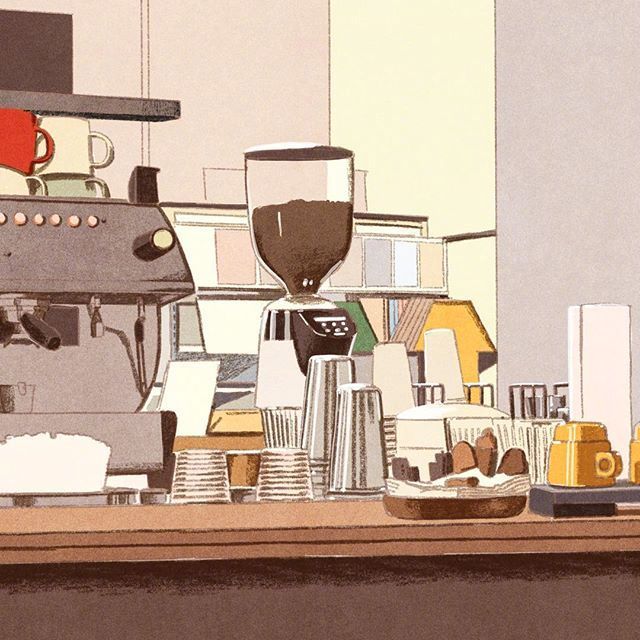 a coffee maker sitting on top of a wooden counter