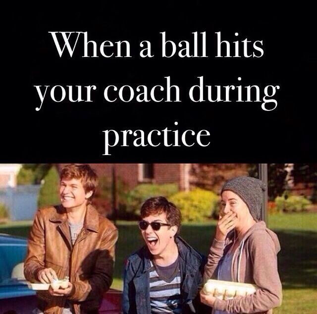 three young men eating hot dogs in front of a blue car with the caption, when a ball hits your coach during practice