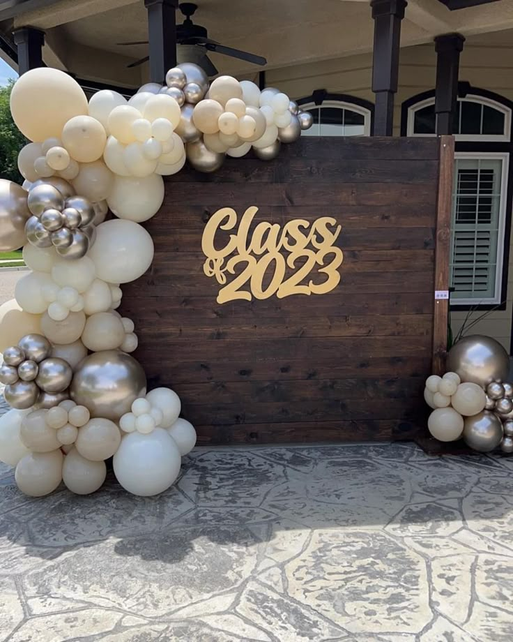 an entrance to a class of 2013 with balloons on the side and gold foil lettering