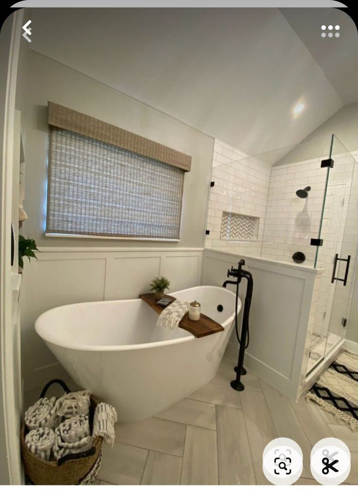 a large white bath tub sitting inside of a bathroom