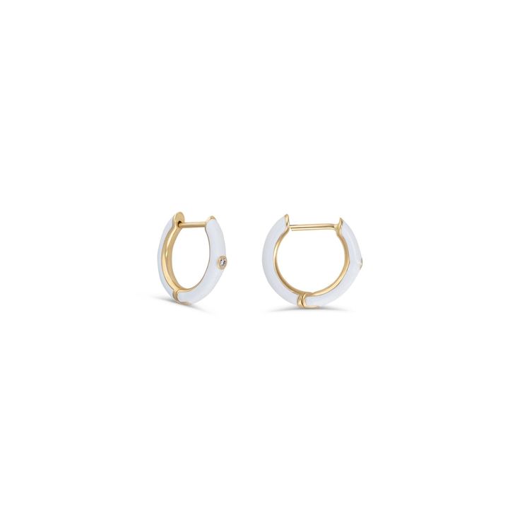 Description Enamel huggie earrings without the mark-ups are finally here. Drop earrings and stud earrings are great, but nothing makes an outfit like enamel hoops. These new arrivals will beautifully adorn your earlobes. Perfect for a first hole, second hole, or cartilage hoop. These enamel huggie earrings are perfect for everyday wear. These diamond huggies feature .02 brilliant-cut carats. Choose the metal type you like best: 14k white gold, 14k yellow gold, 14k rose gold. These bestselling en White 14k Gold Timeless Earrings, Timeless White 14k Gold Earrings, White Huggie Earrings With Diamond Accents, White Huggie Jewelry With Diamond Accents, White Hoop Diamond Earrings With Single Cut, Minimalist White Diamond Earrings With Single Stone, Minimalist White Diamond Earrings With Single Diamond, Luxury White Earrings For Everyday, Fine Jewelry White Small Hoop Earrings