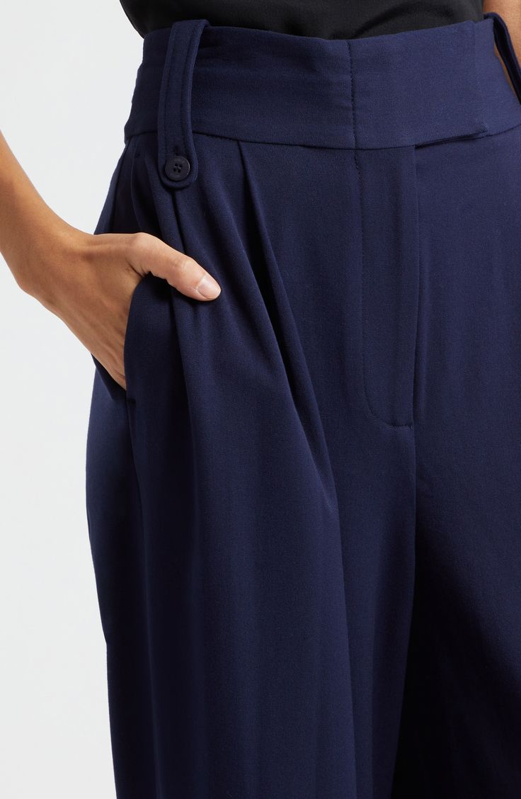 Pleated pants are cut with wideswept legs and plenty of pockets and button-tab details. 29" inseam; 27" leg opening; 15 1/2" front rise; 18" back rise (size 8) Zip fly with hook-and-bar closure Front slant pockets; back button-flap pockets Adjustable button side tabs Lined 63% polyester, 31% viscose, 6% spandex Dry clean Imported Tailored Wide-leg Pants With Pockets, Wide-leg Pants With Button Closure, Classic Wide Leg Dress Pants With Button Closure, Formal Wide-leg Bottoms With Button Closure, Formal Wide Leg Bottoms With Button Closure, Formal Wide Leg Dress Pants With Button Closure, Elegant Tapered Leg Bottoms With Buttons, Classic Wide Leg Dress Pants With Buttons, Tailored Wide Leg Dress Pants With Button Closure