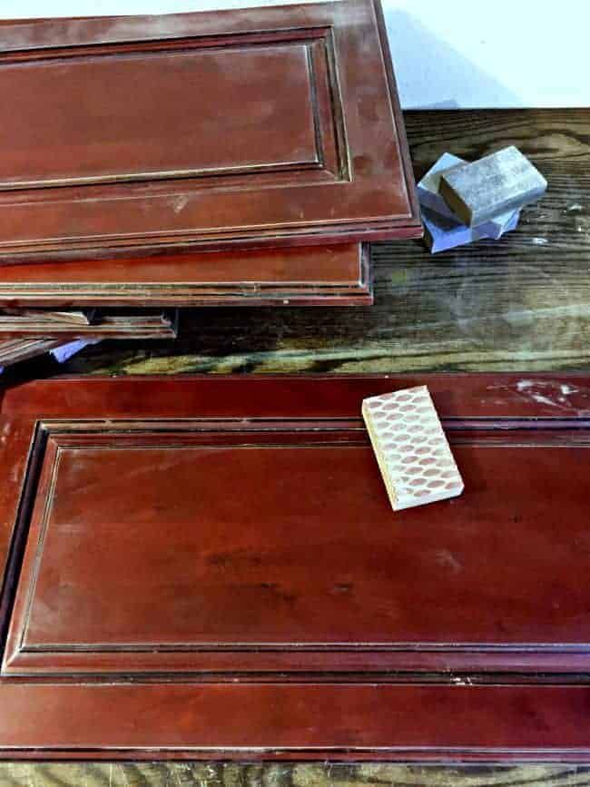 two brown wooden trays sitting on top of a table next to a remote control