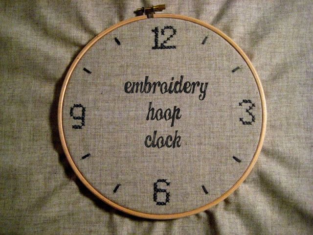 an embroidered hoop with the words embroidery hoop clock