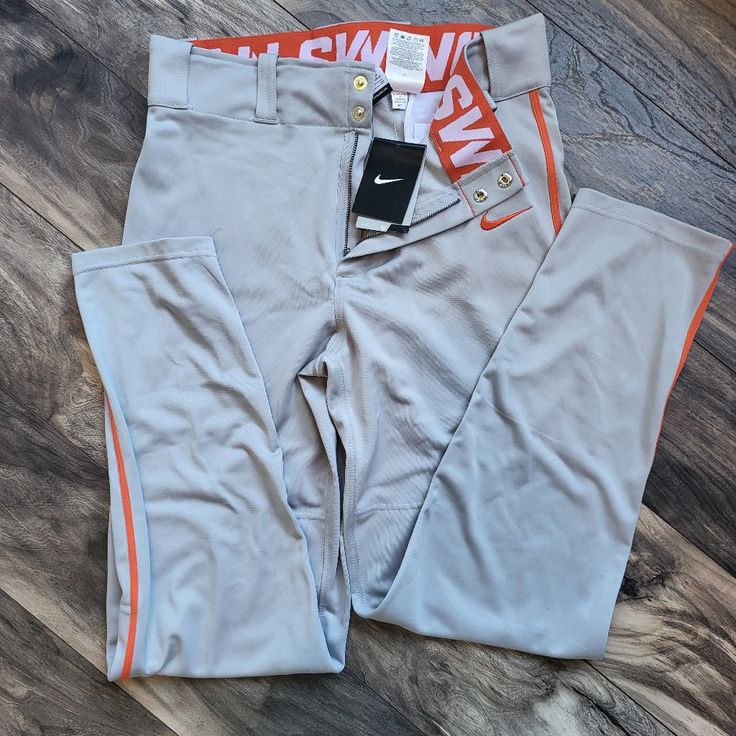 Nike Mens Dryfit Softball/Baseball Pants Gray And Orange Small 100% Polyester Nwt Casual Orange Sports Pants, Sporty Orange Training Bottoms, Sporty Orange Bottoms For Training, Nike Sports Pants For Sports Season, Sporty Orange Bottoms For Streetwear, Sporty Orange Pants For Streetwear, Nike Sports Pants Full Length, Nike Full Length Sports Bottoms, Orange Fitted Sports Bottoms