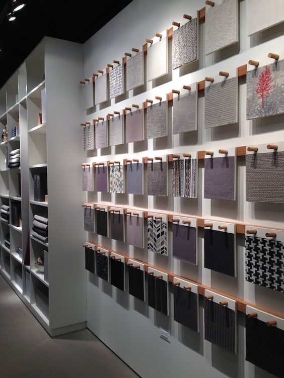 a wall that has many different types of fabric on it