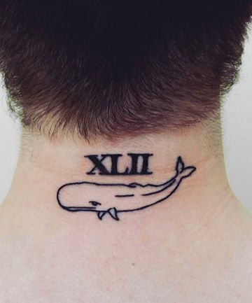 a man with a tattoo on his neck that reads xiii and has an image of a whale