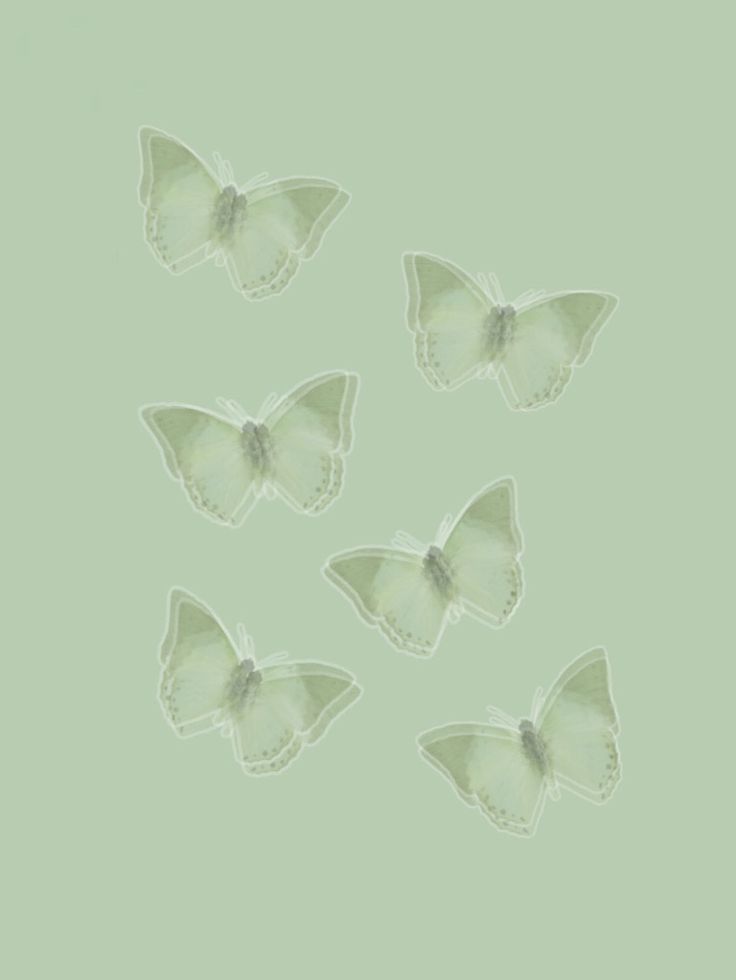 six white butterflies on a green background with space for the word'i love you '