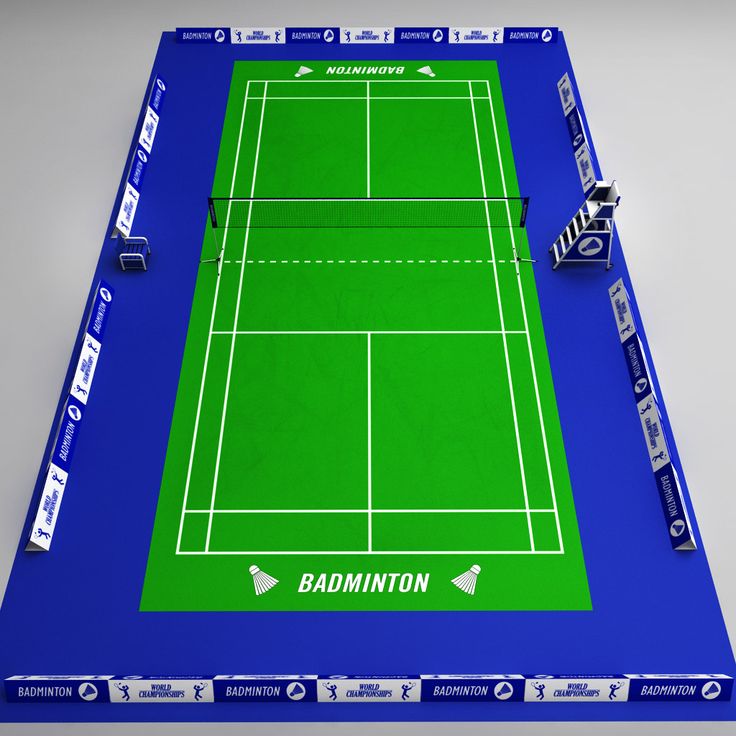 a blue and green tennis court with the words badminton on it, surrounded by stickers