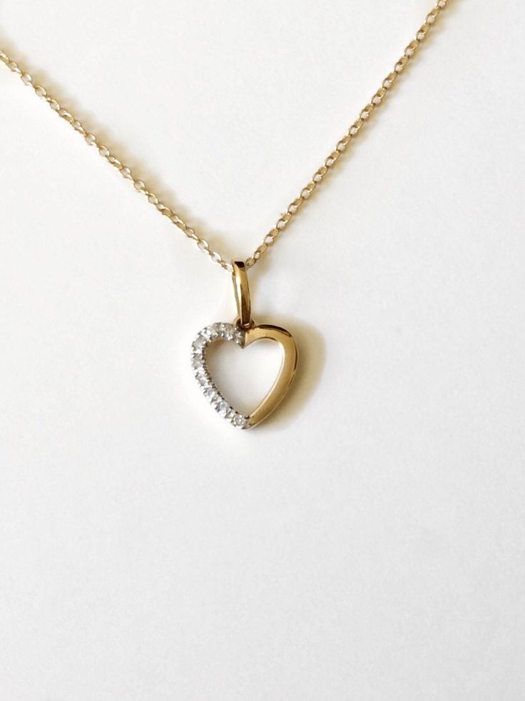 The floating heart necklace is made of 14k gold and adorned with tiny diamonds in pave setting. The delicate cable chain is also 14k gold in the color of your choice. Ideal as a gift for a special someone or to yourself. - available in 14k yellow, white, and rose gold - I can also use silver or gold filled chains. Please feel free to leave me a message so I can give you the price. - I always upgrade the shipping to Priority mail for orders of $100 or more - comes in a little box and ready for gi Yellow Gold Diamond Open Heart Necklace, Yellow Gold Diamond Necklace With Open Heart Design, 14k Gold Open Heart Necklace With Diamond Accents, Yellow Gold Diamond Necklace With Open Heart Shape, Diamond Open Heart Necklace In Yellow Gold, 14k Gold Heart Diamond Necklace With Accents, 14k Gold Heart Diamond Necklace With Diamond Accents, Yellow Gold Heart Necklace With Diamond And Delicate Chain, Heart-shaped Diamond Necklace With 14k Gold