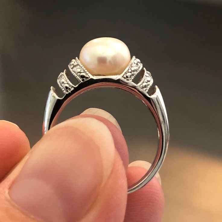 Sterling Silver Ring With Large Cultured Pearl Set Between Four Rows Of Tiny Diamonds (0.4 Karat Total). Elegant And Classic, Never Worn, Tag Attached. Silver Akoya Pearl Rings With Diamond Accents, Macy's White Gold Diamond Ring Gift, Macy's Round Cut Ring As Gift, Macy's Round Cut Rings As Gift, Macy's White Gold Rings As Gift, Elegant Macy's Jewelry With Center Stone, Macy's White Gold Rings For Gift, Classic Macy's Rings As A Gift, Classic Macy's Rings For Gift