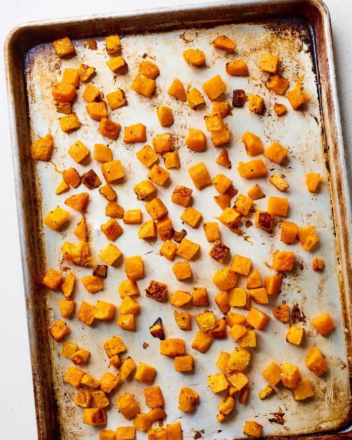 roasted sweet potatoes on a baking sheet ready to go into the oven