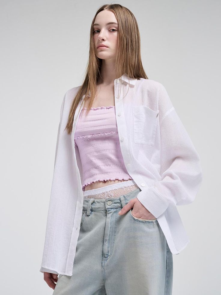 This product blends casual comfort with unique detailing, presenting an Oversized Pocket Summer Shirt that's both stylish and versatile. The relaxed fit offers a breezy option for warm days, while the large pocket detail adds a functional yet fashionable touch. Its oversized nature makes it a perfect layering piece or a standalone statement item. - Designed with an oversized fit for a relaxed and comfortable feel, ideal for the summer season.- Features a large front pocket that combines practicality with a stylish edge.- The shirt comes with a soft, breathable fabric that ensures comfort even on the hottest days.- Subtle branding elements give it a distinct identity without overpowering the simple elegance of the shirt. Chic Casual Tops With Pockets, Chic Tops With Pockets For Casual Gatherings, Daywear Tops With Pockets And Shirttail Hem, Trendy Shirt With Pockets For Daywear, Trendy Daywear Shirt With Pockets, Relaxed Button-up Blouse With Pockets, Oversized Casual Blouse With Pockets, Casual Oversized Blouse With Pockets, Oversized Relaxed Shirt With Pockets