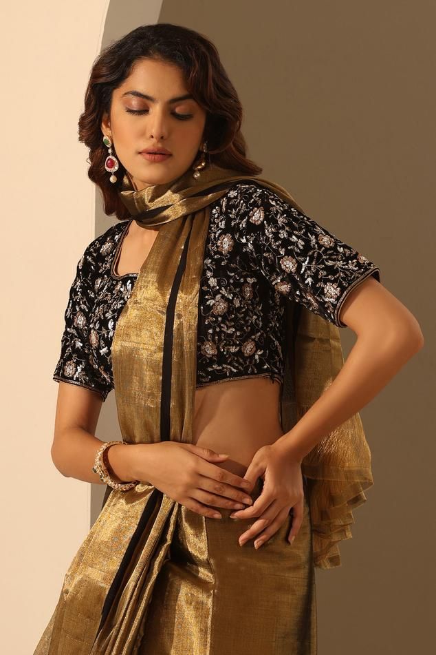 Black blouse crafted in velvet base with all over floral hand embroidery.
Components: 1
Pattern: Hand Embroidery
Type Of Work: Floral
Neckline: Square Neck
Sleeve Type: Half Sleeves
Fabric: Velvet
Color: Black
Other Details: 
Model height: 5ft 6inches, wearing size S
Back tie-up detailing
Note: The saree worn by the model is not for sale
Occasion: Sangeet - Aza Fashions Elegant Velvet Choli With Traditional Drape, Elegant Velvet Choli With Resham Embroidery, Embroidered Velvet Choli With Traditional Drape, Festive Velvet Blouse Piece With Zari Work, Traditional Velvet Blouse Piece For Festive Occasions, Traditional Evening Blouse With Intricate Embroidery, Festive Black Blouse Piece With Floral Embroidery, Embroidered Velvet Choli For Reception, Elegant Velvet Blouse For Wedding