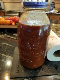 a jar filled with liquid sitting on top of a counter