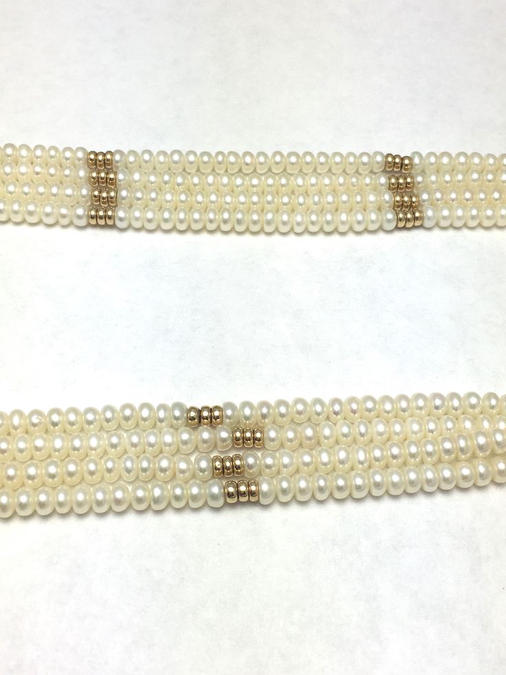 "Four Row Freshwater Pearl and 14K Yellow Gold Beads and Clasp 4 Rows Button Shape Freshwater Pearls Large Spring Ring Clasp measures approx. 6/8\" round Necklace Measures approx. 18 1/2\" long or 46 cm Freshwater Pearls average diameter: 4 mm Pearls are white in color with good luster 84 Gold Beads - Solid 14K Yellow Gold Stamped: \"585\" on clasp Weight: 56 grams Beautiful pearl necklace for a vintage wedding 050516-4257 FEEL FREE TO MESSAGE ME WITH A BEST OFFER OR IF YOU WISH TO SEE MORE PICT Formal Pearl Necklace With Polished Beads, Yellow Gold Single Strand Pearl Necklace For Wedding, Yellow Gold Beaded Pearl Necklace For Wedding, Wedding Yellow Gold Beaded Pearl Necklace, Luxury Round Bead Pearl Necklace For Wedding, Classic Polished Pearl Necklace For Wedding, Yellow Gold Beaded Pearl Necklace For Formal Occasions, Traditional Single Strand Pearl Necklace For Wedding, Classic Wedding Pearl Necklace With Polished Beads