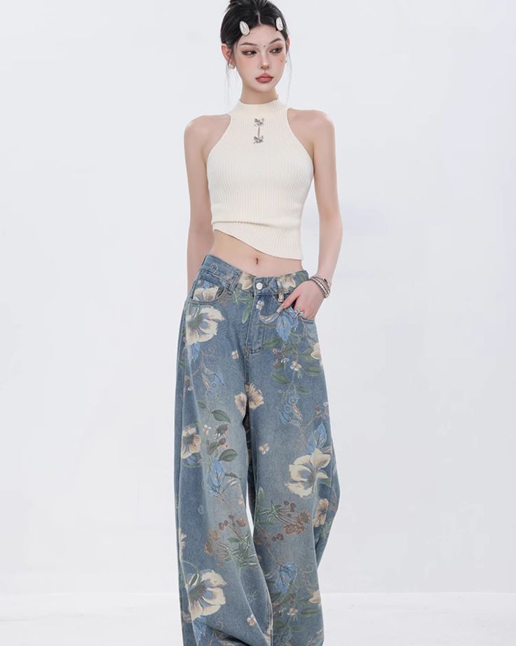 Cute denim pants with a floral design that attracts attention.

This piece is a well-balanced mix of casual and girly elements.

The thick wide silhouette does not emphasize the line of your legs and makes it easy to maintain balance.
◾️Model
Height/Weight：163cm(64.1in)/44kg(97.0lb)
Fitting Size：S





Cm
(inches)

Length
Waist
Hip


S
104(40.9)
62(24.4)
104(40.9)


M
106(41.7)
66(25.9)
108(42.5)


L
108(42.5)
70(27.5)
112(44.0)


XL
110(43.3)
74(29.1)
116(45.6) Casual Floral Print Wide Leg Pants For Spring, Casual Floral Print Cotton Wide Leg Pants, Spring Jeans With Five Pockets, Spring Floral Print High Waist Wide Leg Pants, Baggy Jeans For Spring, Spring Floral Print Straight Leg Bottoms, Casual Denim Bottoms With Floral Print, Baggy Floral Print Bottoms For Spring, Floral Print Wide Leg Denim Bottoms