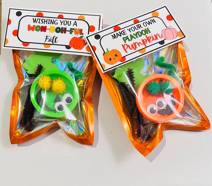 two plastic bags filled with halloween themed items