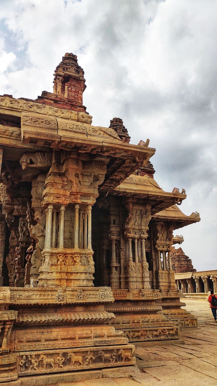 an elaborately carved stone structure in the middle of a courtyard