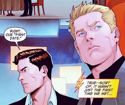 the comic panel shows two men in suits, one with blonde hair and another with blue eyes