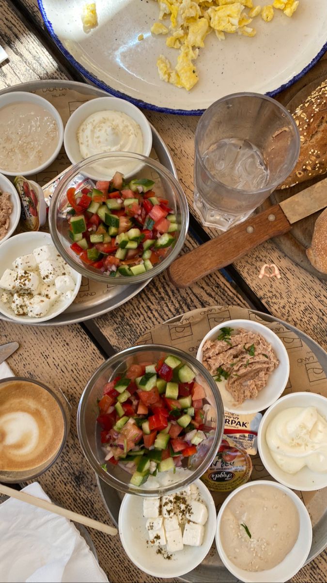 two plates filled with food sitting on top of a wooden table