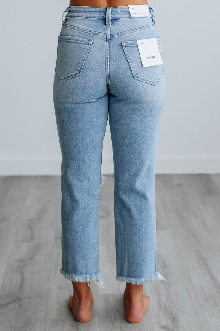 Details: Victoria Vervet Jeans High Rise Intentional Distressing Straight Leg Raw Edge Frayed Hems Zip Fly Button Closure Cropped Length Good Stretch Available in Light Wash Rise: 10" Inseam: 25" Leg Opening: 15" Material: 93% Cotton, 5% Polyester, and 2% Spandex We are recommending true to size! *Victoria is the fit of the jeans. Victoria jeans may differ in wash/look/distressing Kan Kan Jeans, Straight Leg Jeans Outfit, Vervet Jeans, Comfortable Fall Outfits, Ecclesiastes 11, Jeans Details, Boho Jeans, Necklace Outfit, Comfy Sandals