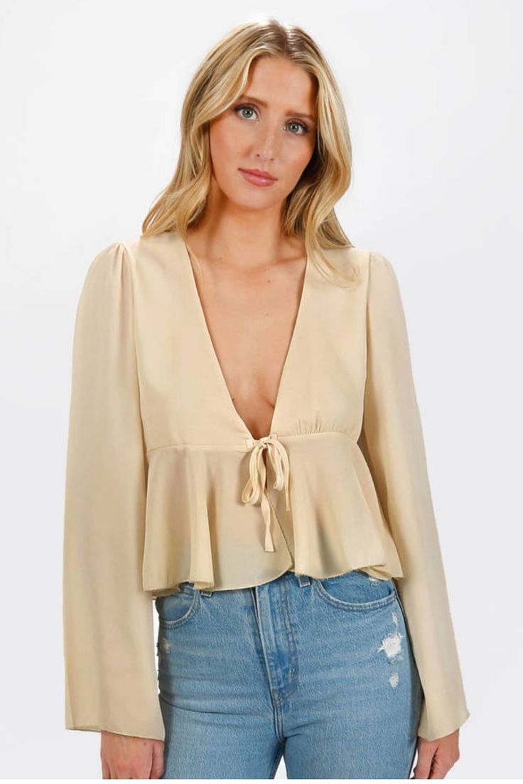 Aalizah Ruffles Blouse https://www.tobi.com/product/79749-tobi-aalizah-ruffles-blouse?color_id=113611&utm_source=pinterest&utm_medium=social&utm_campaign={campaignid}_{adgroupid}_{product_id} Chic Flowy V-neck Blouse, Feminine Beige Blouse With Lantern Sleeves, Spring Long Sleeve Beige Blouse, Party V-neck Blouse With Blouson Sleeves, Flowy V-neck Blouse For Fall, Feminine Long Sleeve Beige Top, Chic V-neck Long Sleeve Top For Spring, Beige Long Sleeve Tops With Blouson Sleeves, Chic Spring V-neck Long Sleeve Top