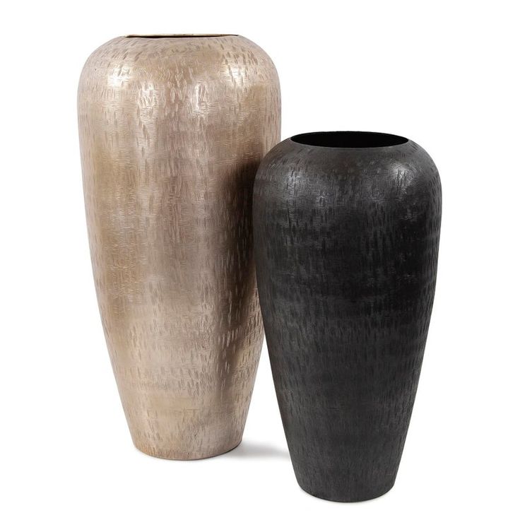 two vases sitting next to each other on a white background