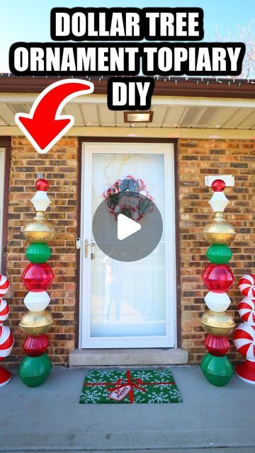 an outdoor christmas decoration with candy canes and ornaments on the front door, in front of a brick house