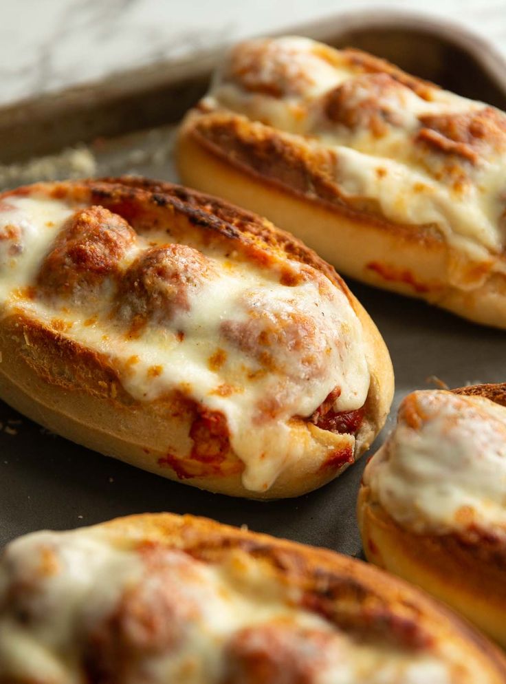 baked bread with cheese and meat on it