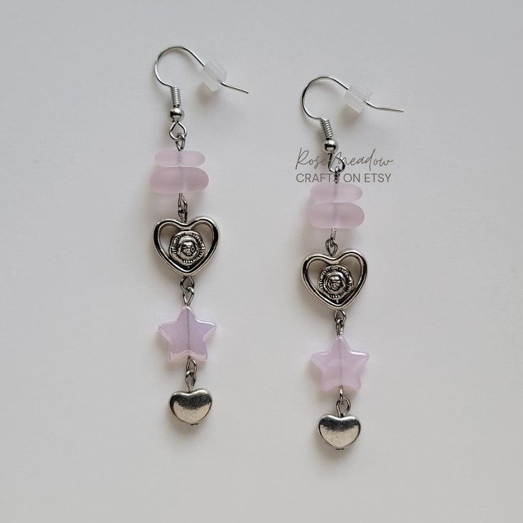 "Handmade Beaded Earrings ✿ Made with glass beads and metal accents ✿ Silver, glossy pink, and matte pink ✿ The earrings are \" long Fish Hook Options ✿ The Titanium fish hook is hypoallergenic and ideal for sensitive skin ✿ The regular fish hook is made of nickel free metal, it is not hypoallergenic" Pink Metal Dangle Crystal Earrings, Pink Dangle Crystal Earrings, Trendy Dangle Earrings With Heart Beads, Nickel-free Pink Dangle Beaded Earrings, Pink Nickel-free Dangle Beaded Earrings, Nickel Free Pink Dangle Beaded Earrings, Pink Metal Heart Earrings For Pierced Ears, Adjustable Heart Beads Dangle Earrings, Adjustable Dangle Heart Earrings