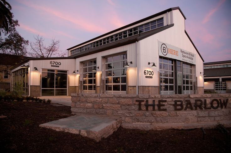 the entrance to the barlow building at dusk